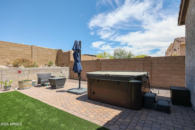 view of patio with a hot tub