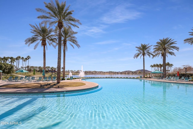 view of pool featuring a water view