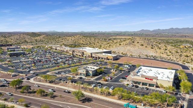 birds eye view of property featuring a mountain view