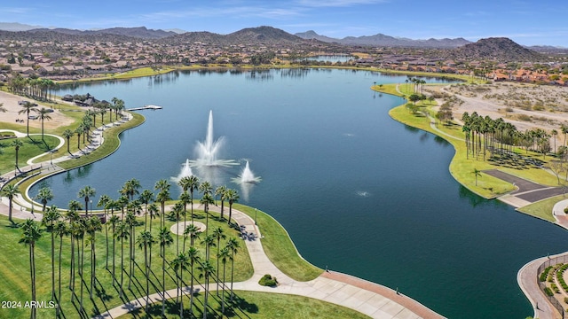 drone / aerial view with a water and mountain view