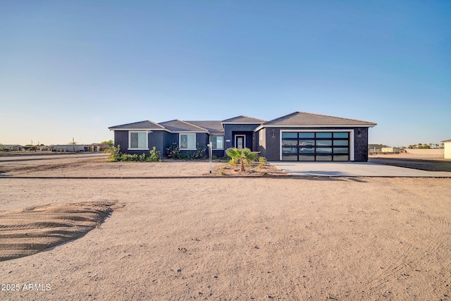 22548 W Huntington Dr, Buckeye, AZ 85326 - view of front of home with driveway and an attached garage