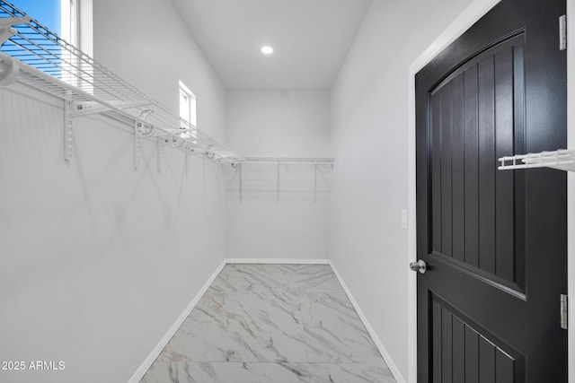 22548 W Huntington Dr, Buckeye, AZ 85326 - spacious closet featuring marble look tiles
