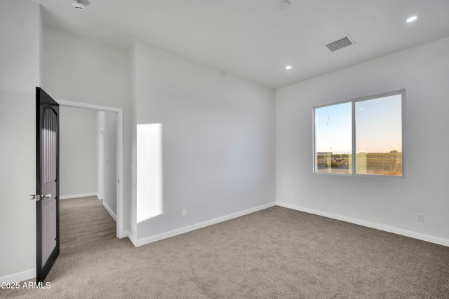 22548 W Huntington Dr, Buckeye, AZ 85326 - unfurnished room featuring carpet, baseboards, and recessed lighting