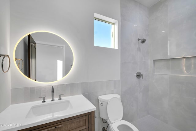 22548 W Huntington Dr, Buckeye, AZ 85326 - full bathroom with vanity, tiled shower, toilet, and tile walls