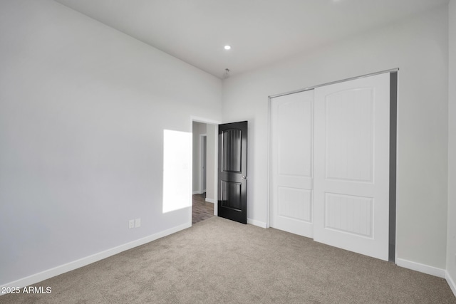 22548 W Huntington Dr, Buckeye, AZ 85326 - unfurnished bedroom with carpet floors, baseboards, a closet, and recessed lighting