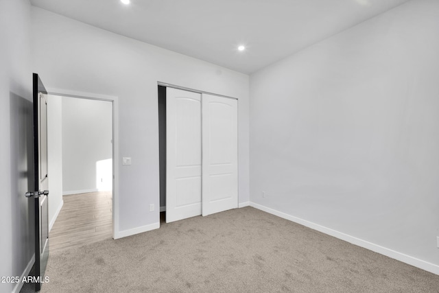 22548 W Huntington Dr, Buckeye, AZ 85326 - unfurnished bedroom with carpet flooring, recessed lighting, baseboards, and a closet