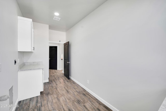 22548 W Huntington Dr, Buckeye, AZ 85326 - unfurnished dining area with dark wood finished floors and baseboards