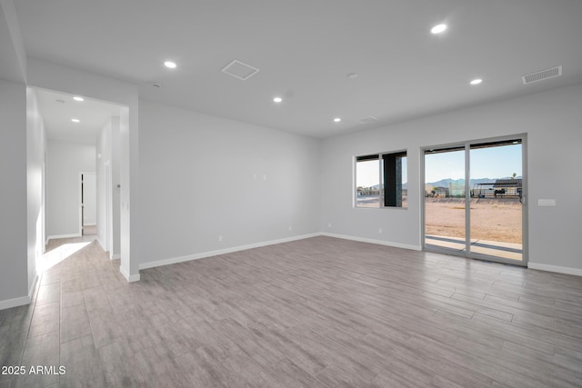 22548 W Huntington Dr, Buckeye, AZ 85326 - unfurnished room with recessed lighting, wood finished floors, and baseboards