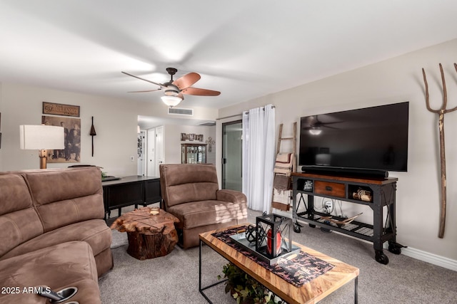 living area with carpet, visible vents, baseboards, and a ceiling fan