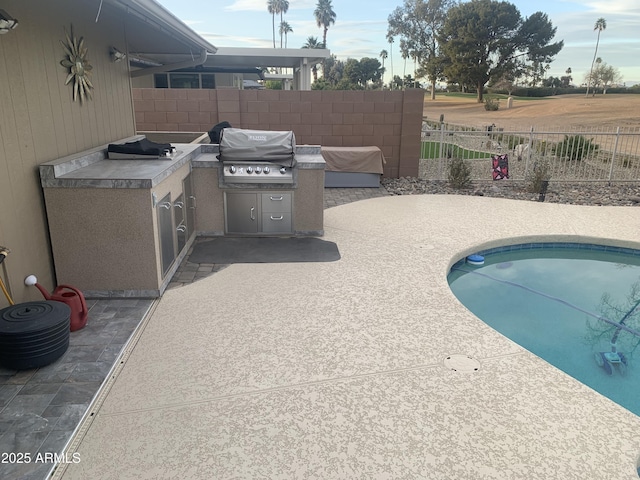 view of pool with a fenced in pool, a patio, area for grilling, a grill, and fence