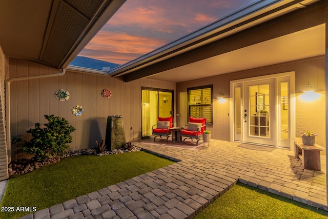 view of patio terrace at dusk