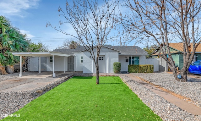 ranch-style house featuring a carport and a front lawn