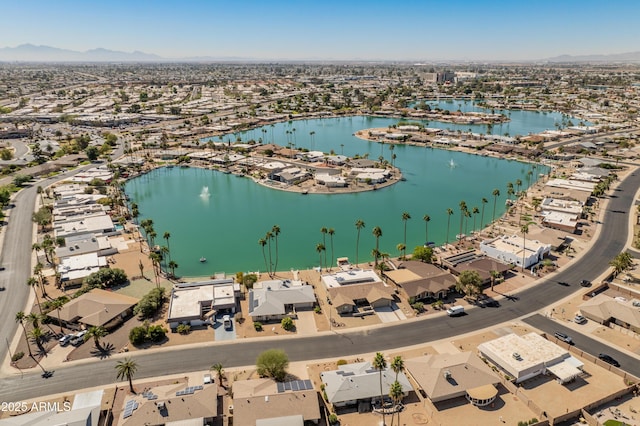 birds eye view of property featuring a water view and a residential view