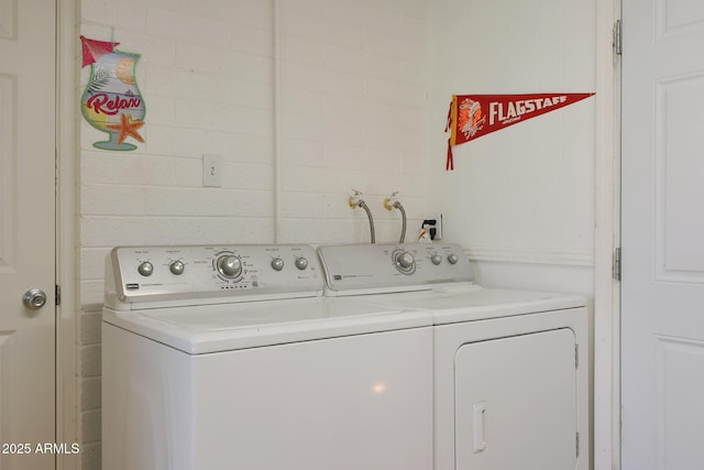 washroom featuring washer and clothes dryer