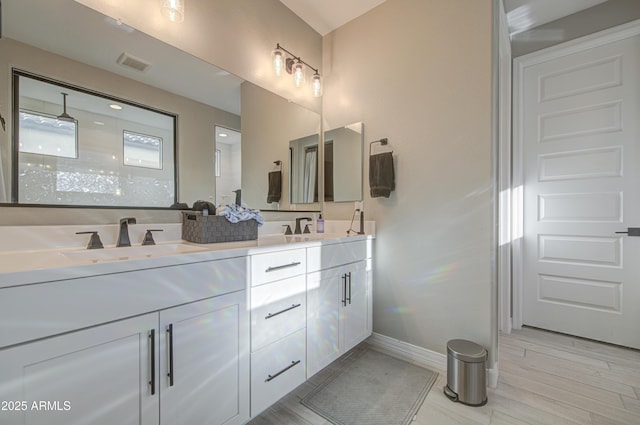 12806 W Mclellan Rd, Glendale, AZ 85307 - full bathroom with double vanity and wood finished floors