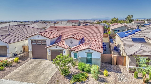 12806 W Mclellan Rd, Glendale, AZ 85307 - view of front of property with a tiled roof, stucco siding, a residential view, driveway, and an attached garage