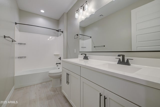 12806 W Mclellan Rd, Glendale, AZ 85307 - bathroom with double vanity, bathing tub / shower combination, wood finished floors, and recessed lighting