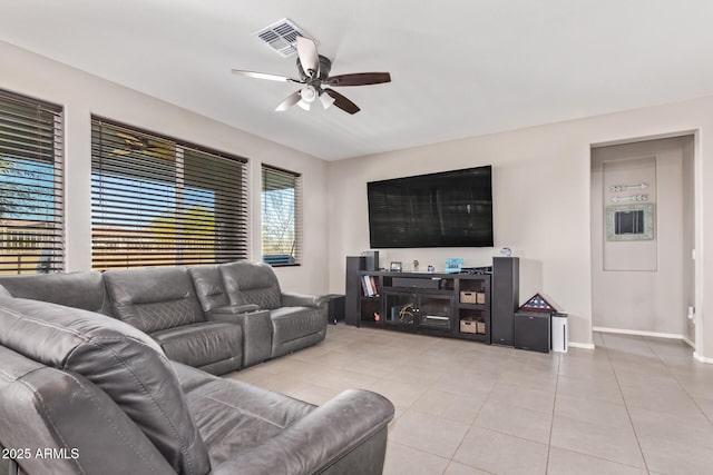 living room featuring light tile patterned floors and ceiling fan