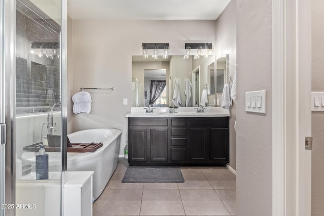 bathroom featuring tile patterned floors, plus walk in shower, and vanity