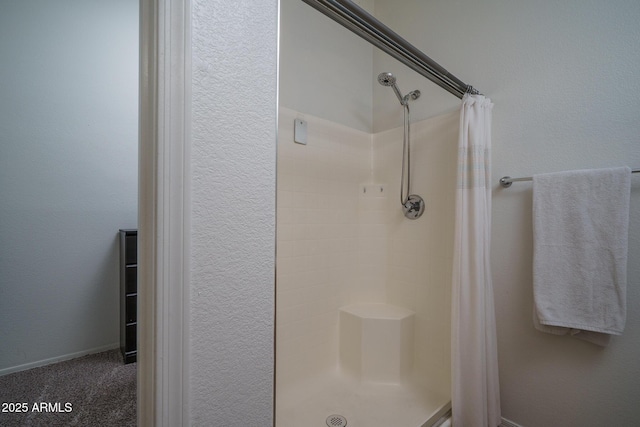bathroom featuring a shower stall