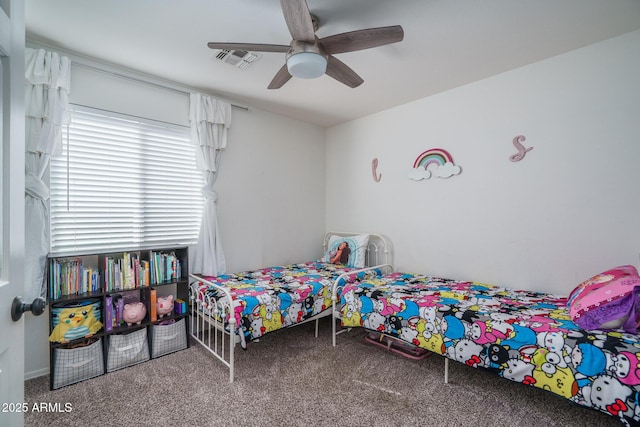 carpeted bedroom featuring visible vents and a ceiling fan