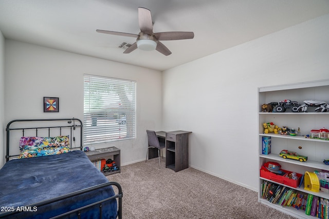 carpeted bedroom featuring ceiling fan, visible vents, and baseboards