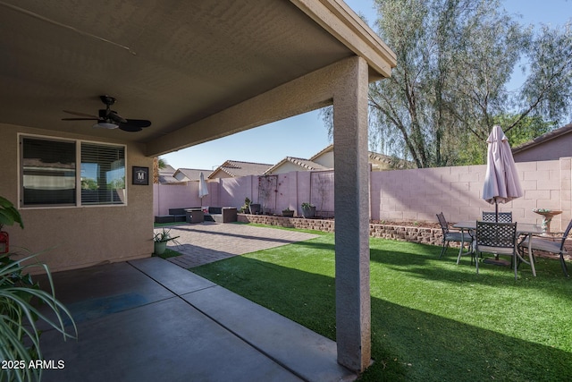 exterior space featuring a fenced backyard, ceiling fan, and a patio area