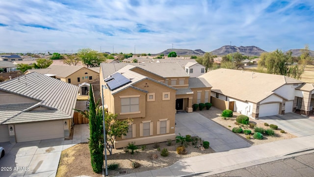 drone / aerial view featuring a residential view and a mountain view