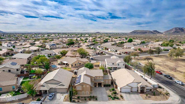 drone / aerial view featuring a residential view and a mountain view