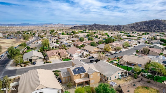 drone / aerial view featuring a residential view and a mountain view