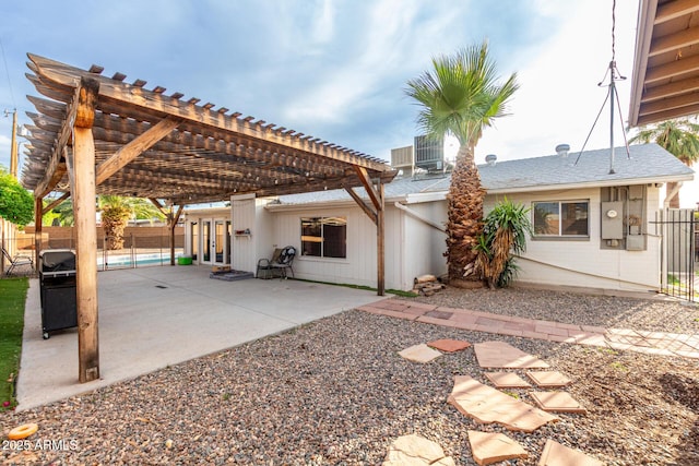 rear view of property with a patio, a pergola, french doors, and a fenced backyard