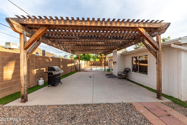 view of patio / terrace with a pergola, a fenced backyard, and a grill