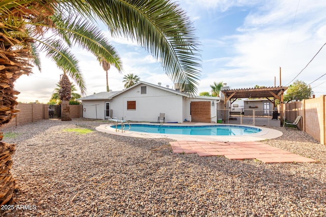 view of pool with a fenced in pool, a fenced backyard, and a pergola