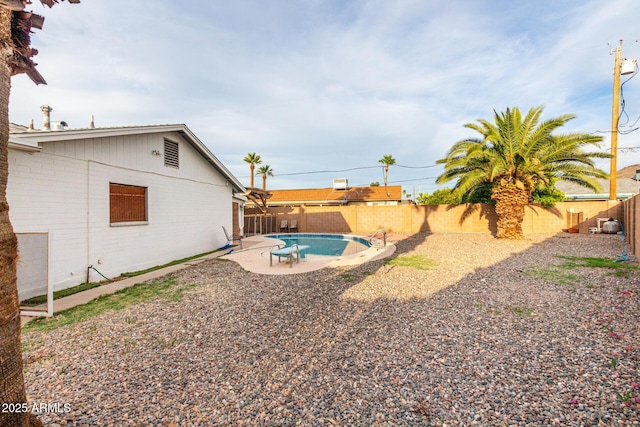 view of yard with a patio, a fenced in pool, and a fenced backyard
