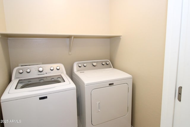 washroom featuring washer and dryer