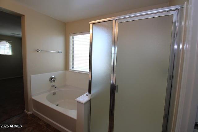 bathroom with tile patterned floors and plus walk in shower