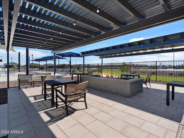 view of patio featuring fence and a pergola