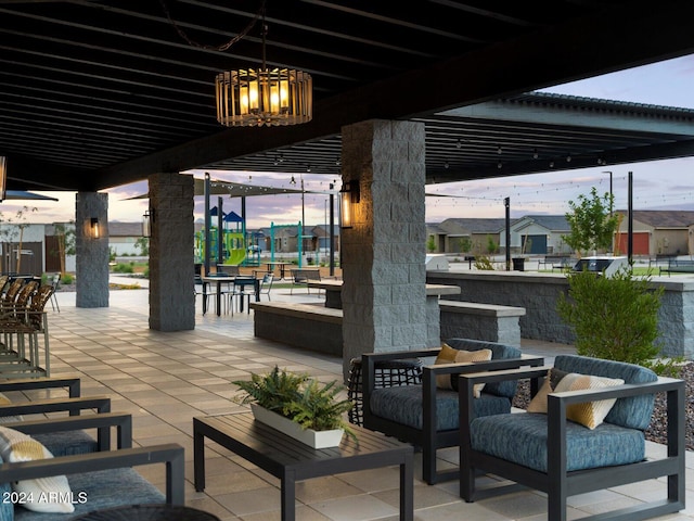 patio terrace at dusk with an outdoor hangout area