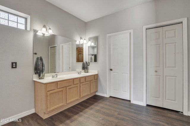 bathroom with vanity and hardwood / wood-style flooring