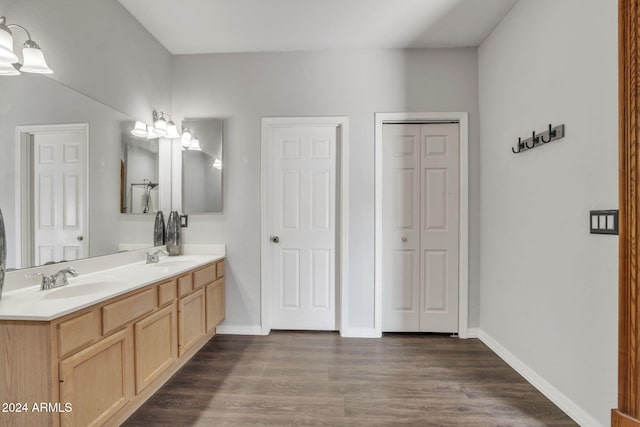 bathroom featuring hardwood / wood-style floors and vanity