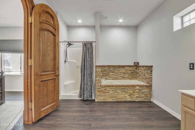 bathroom with vanity, separate shower and tub, and wood-type flooring