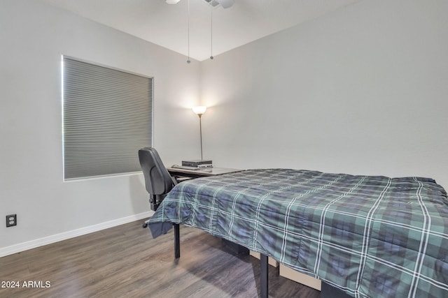 bedroom with ceiling fan and wood-type flooring