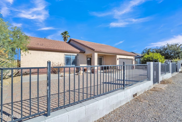 view of front of property featuring a garage