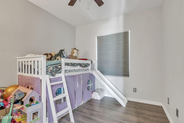 bedroom with ceiling fan and dark wood-type flooring