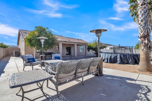 view of patio featuring outdoor lounge area and a trampoline