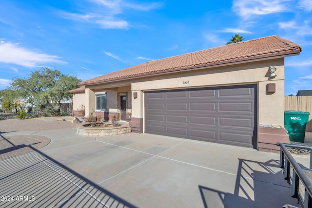 mediterranean / spanish-style home with a garage