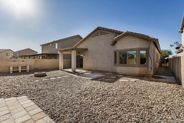 rear view of house with a patio