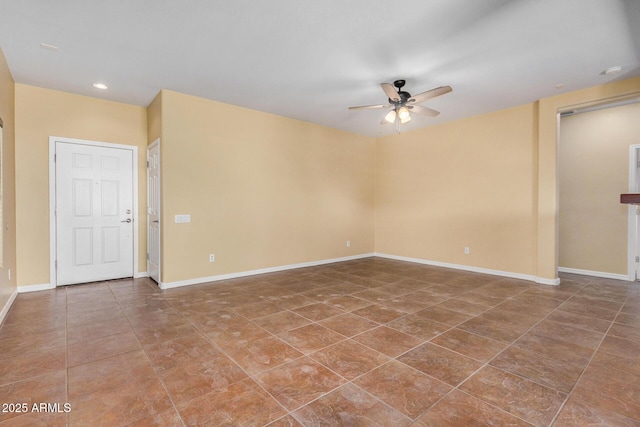 spare room with ceiling fan