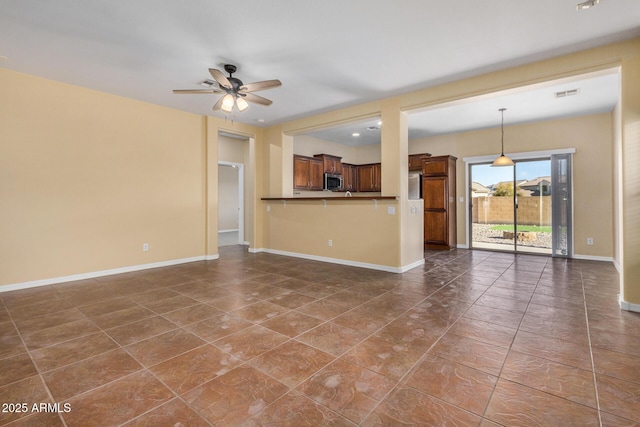 unfurnished living room featuring ceiling fan