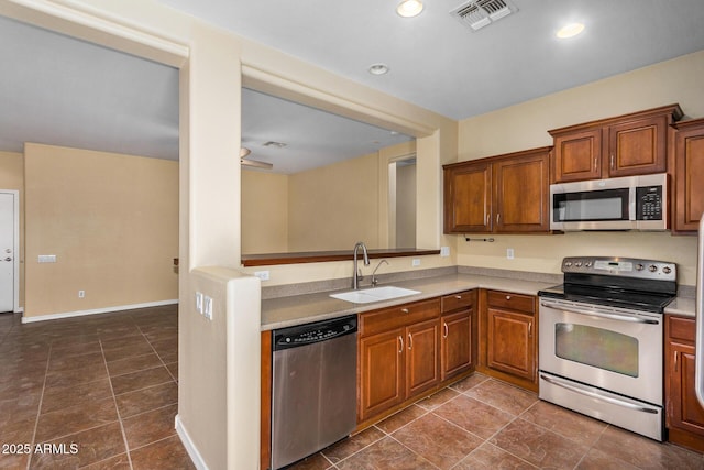 kitchen with sink and appliances with stainless steel finishes